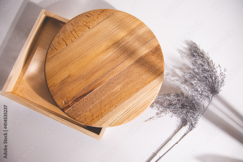 Wall mural grass on a wooden plate