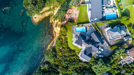 Residential houses overlooking the beautiful harbor from the top of a cliff. Auckland, New Zealand