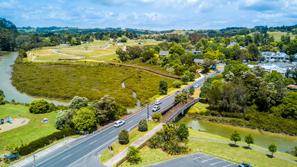 Aerial view on a bridge across a small river on a sunny day. Auckland, New Zealand.