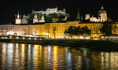 Fototapeta na wymiar Europe, Austria, Salzburg, Salzburg at night and Reflections in the Water