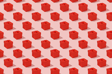 Pattern: red gift mini boxes on pink background. Horizontal photo.