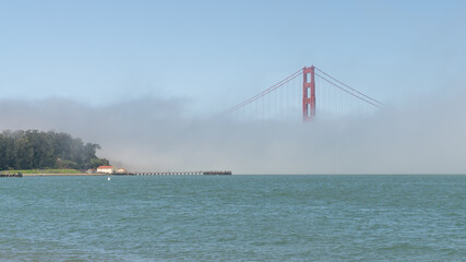 San Francisco, USA - August 2019: Golden Gate Bridge under fog, with one tower visible. The Golden...