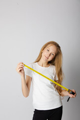 Cute girl on a white background with construction tools