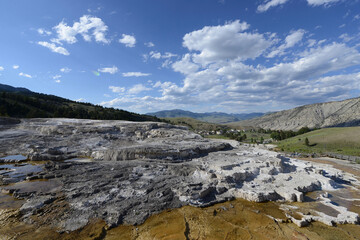 Fototapeta na wymiar Scenic view of the terraces at Mammoth Hot Springs at Yellowstone National Park on a sunny day