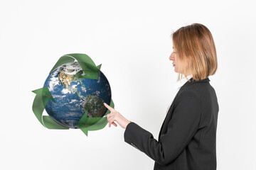 Young woman pointing on Planet Earth 3d model surrounded by recycle icon in a International Mother Earth Day concept