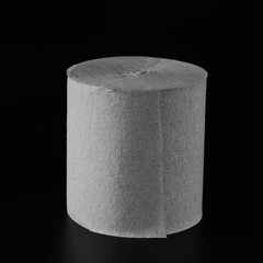 Roll of toilet paper on black background isolated