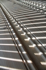 Sunlight stripes on a wood