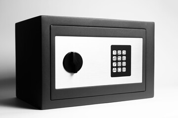 Close-up of security safe box on white background. Black and white photo.