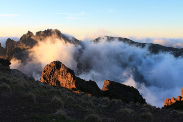 Sunset over the clouds in the mountains