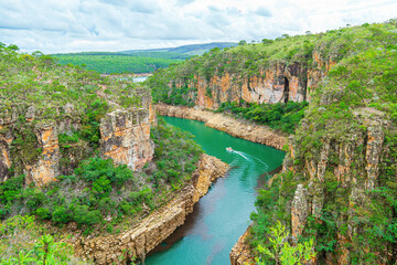 Tourist boat navigating between the Canyons of Furnas, Capitólio MG Brazil. Beautiful landscape of...