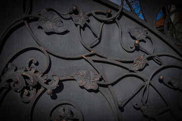 Decorative elements of a metal gate in the form of leaves