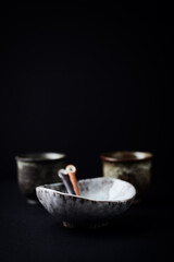 Traditional, handcrafted ceramic on dark background. Soft focus. Copy space.