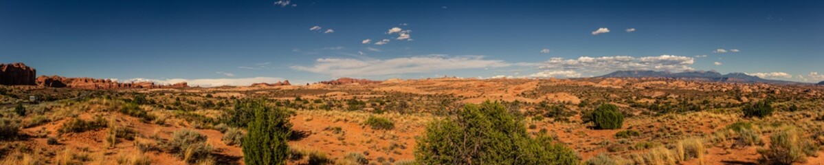 Paorama shot of american desert nature with red sandstone mountains in arches national park in utah, america © AllThings