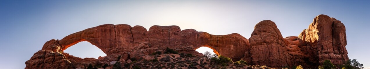 Panorama shot of red sandstone arches at summer sunny day in Arches national park in Utah, America