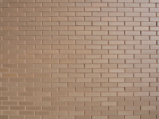 The wall is tiled with brick-like tiles.
