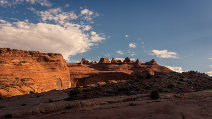 Panorama shot of red sandstone arch with monoliths and sculpturas at morning light in Arches national park in Utah, America
