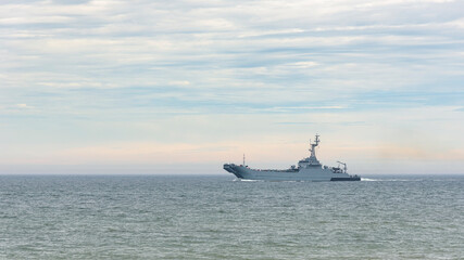 Military ship patrolling sea coast