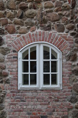 Fototapeta na wymiar Window of an old monastery in Europe