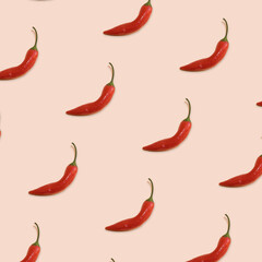 pattern of red chilli peppers on salmon background. Top view