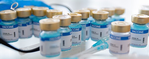 Coronavirus vaccine ampoules medical and syringe with a vaccine. Covid-19 vaccine research.