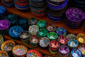 Fototapeta na wymiar Traditional turkish crockery at oriental bazaar. Souvenirs from Turkey