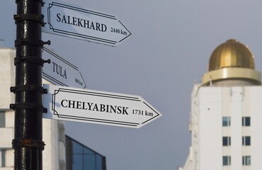 Obraz premium City signpost with white arrows giving directions to Salekhard, Tula and Chelyabinsk (Russia)