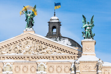 Fototapeta na wymiar LVIV, UKRAINE - FEBRUARY 10, 2021: Lviv Theatre of Opera and Ballet, Lviv opera house, winter time. The building is crowned by large bronze statues, symbolizing Glory, Poetry and Music.