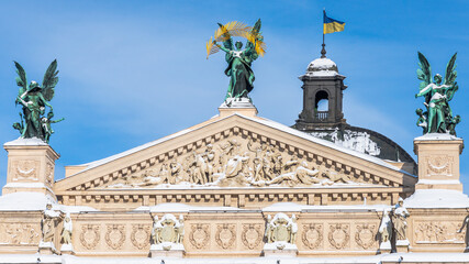 Fototapeta na wymiar LVIV, UKRAINE - FEBRUARY 10, 2021: Lviv Theatre of Opera and Ballet, Lviv opera house, winter time. The building is crowned by large bronze statues, symbolizing Glory, Poetry and Music.