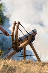 Man Shoots With Gun - White Smoke In The Background