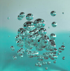 Abstract  metallic turquoise bubbles on turquoise background
