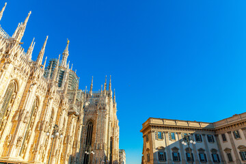 Famous church Milan Cathedral Duomo di Milano with Gothic spires and white marble statues. Top...