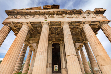 Naklejka premium Ancient Temple of Hephaestus. Columns Agora Marketplace, Athens, Greece. Agora founded 6th Century BC. Temple for God of craftsmanship, metalworking from 449 BC