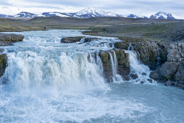 Iceland, Southern Highlands, Gygjarfoss waterfall. This small waterfall flowing through a rather barren landscape.