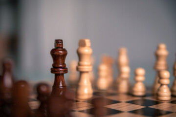 Chess pieces set up ready to play chess game on a wooden board strategy game kings head to head...