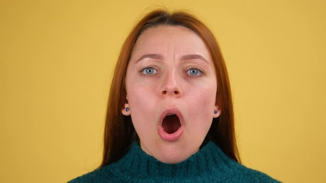 I can't believe this. Amazed startled young woman looking at camera with big eyes surprised shocked expression, open mouth in amazement. studio isolated on yellow background