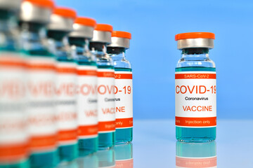 Coronavirus Covid-19 vaccine injection in glass bottles.