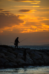 fishing at sunset