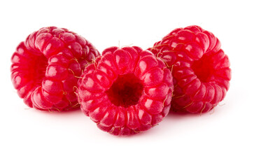 three ripe raspberries isolated on white background close up