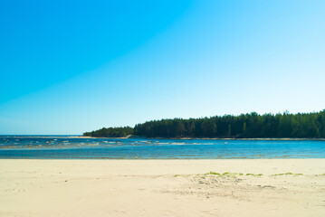 beach.in the photo, the sea shore against the blue sky