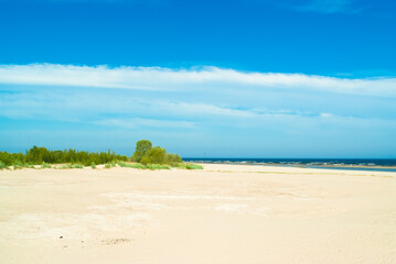 Fototapeta na wymiar beach.in the photo, the sea shore against the blue sky