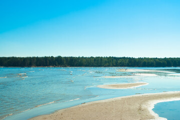 beach.in the photo, the sea shore against the blue sky