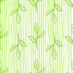 Botany seamless pattern with green contoured leaves branches ornament. Striped background.