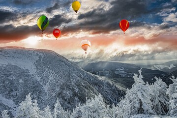 a balloon flies against the sky . winter landscape from a height of
