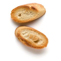 Toasted baguette slices isolated on white background close up.  Toast, crouton.   Top view.
