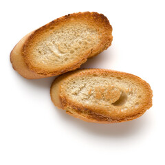 Toasted baguette slices isolated on white background close up.  Toast, crouton.   Top view.