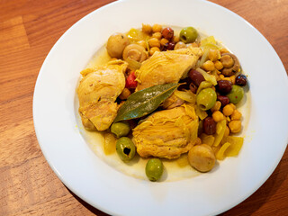 Chicken with chickpeas, olives, onions, and mushrooms dinner