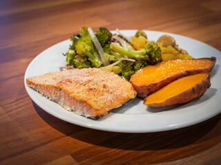 Mustard crusted salmon dinner with roasted sweet potato, broccoli, and chickpeas