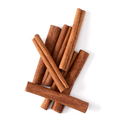 Cinnamon sticks isolated on white background closeup. Canella spice. Aromatic condiment background. Flat lay, top view.