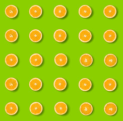  Fruit pattern of orange slices on grren  background. Flat lay, top view. Food background. Seamless pattern.