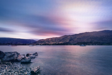 Colorful Sunset at Wanaka lake-front from Eely Point Recreation Reserve. Wanaka is a popular ski...